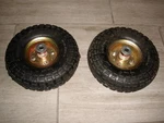 2- Tires W/gold Hubs Haul-master 10" Pneumatic 4.10/3.50-4 300 Lbs. Max. Fixed Price $42.41.