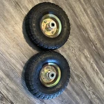 Set Of 2 Haul-master 4.10/3.50-4 Pneumatic Tire With Gold Hub. Fixed Price $35.00.